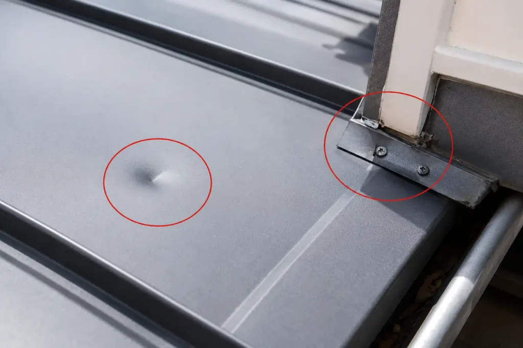 metal roof dent inspection near seams and flashing