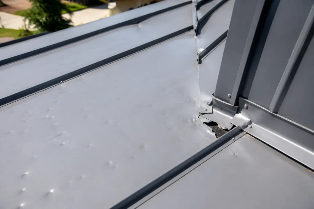 will insurance cover a metal roof with hail dents and flashing damage