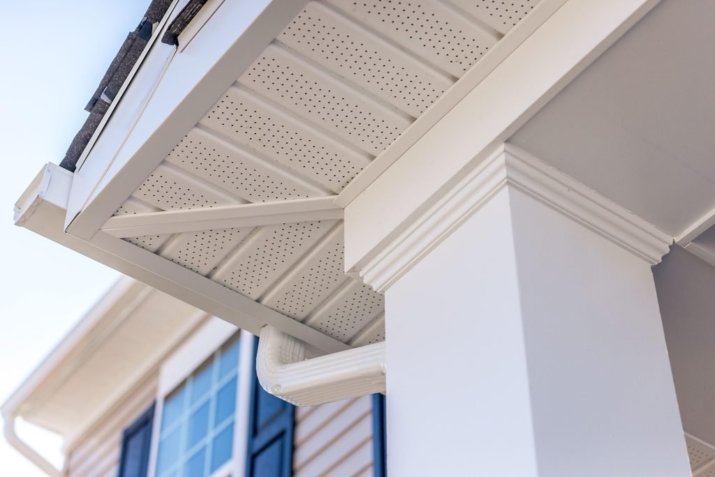 Soffit intake ventilation under roof eaves during roof replacement